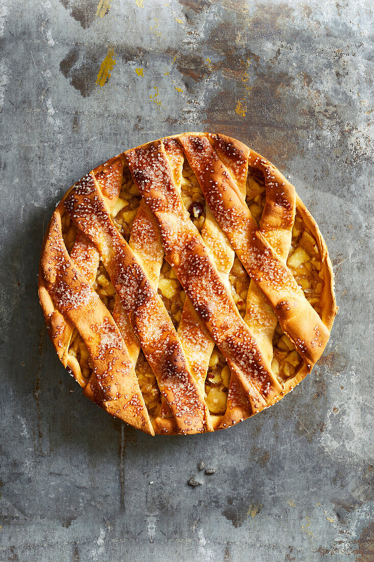 Homemade apple pie on grey metal background