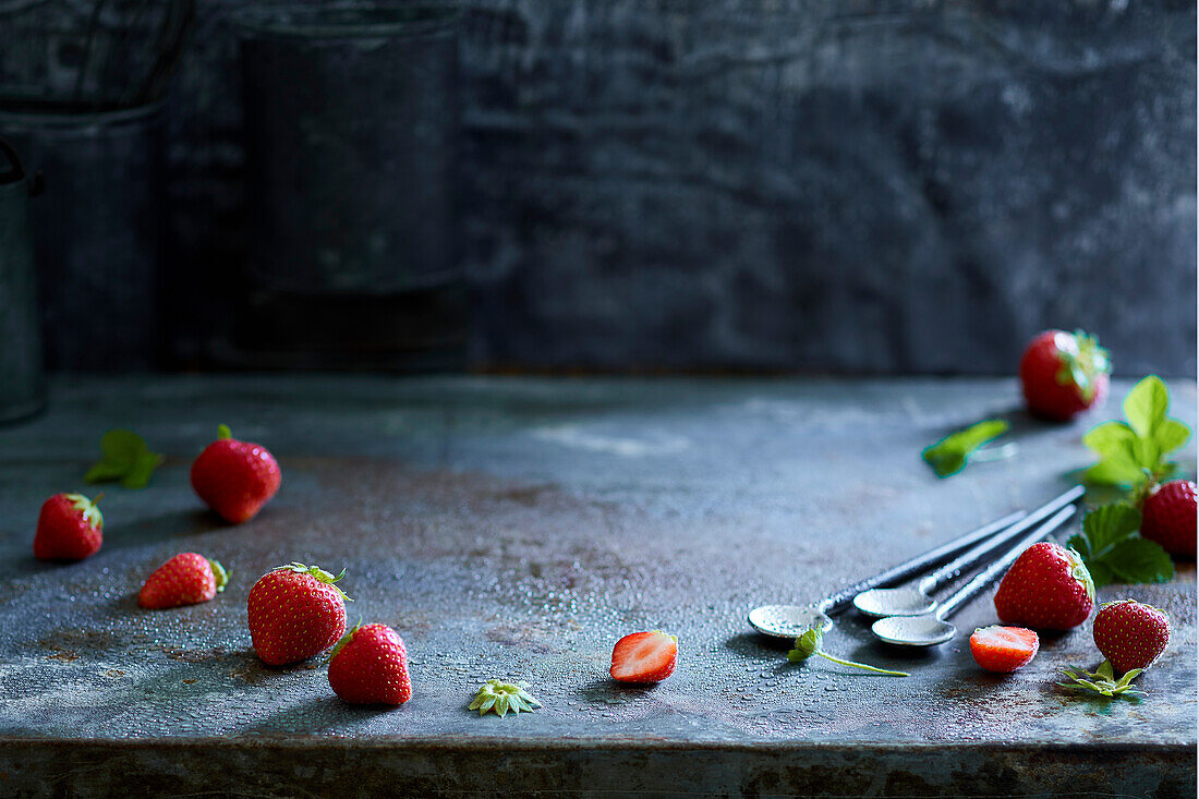 Fresh strawberries on a gray metal background