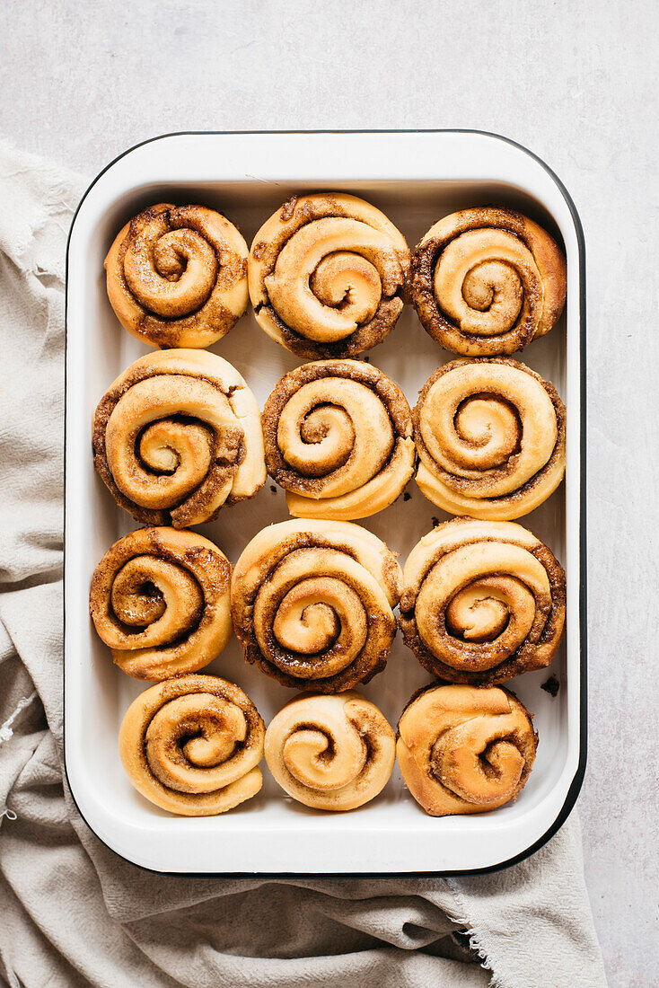 Cinnamon Buns baked in a dish on a bright background