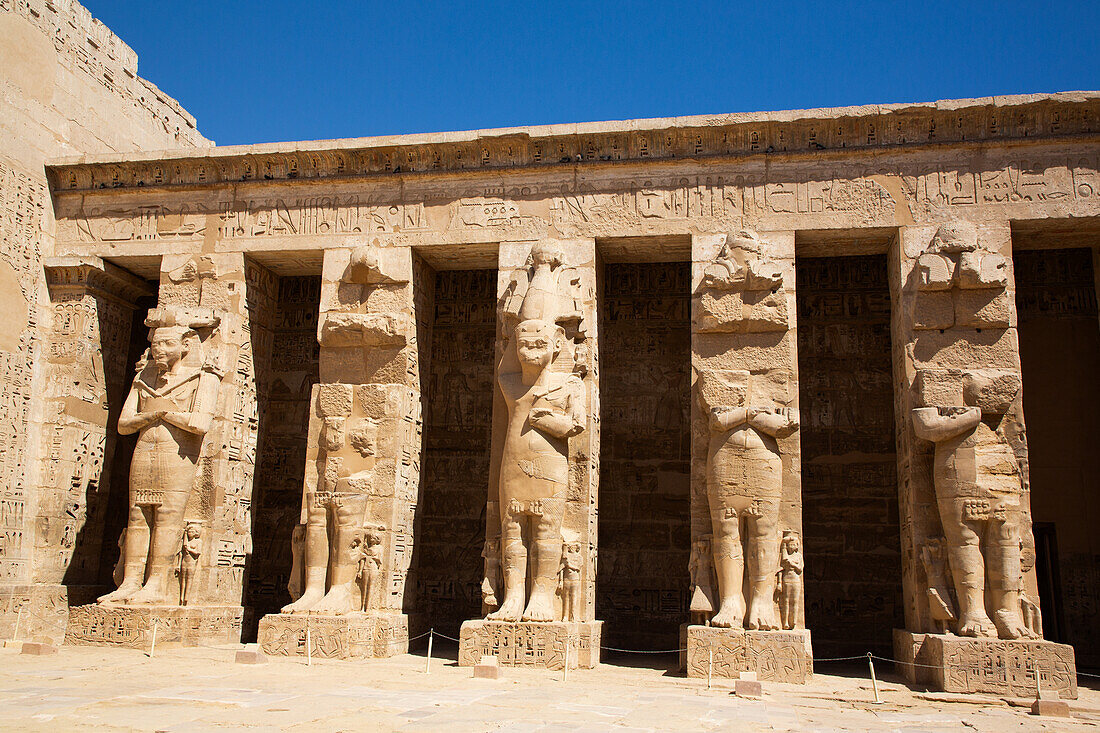 Osirian Statues, Northern Portico, First Courtyard, Medinet Habu, Mortuary Temple of Ramesses III, 1187-56 BCE, Ancient Thebes, UNESCO World Heritage Site, Luxor, Egypt, North Africa, Africa