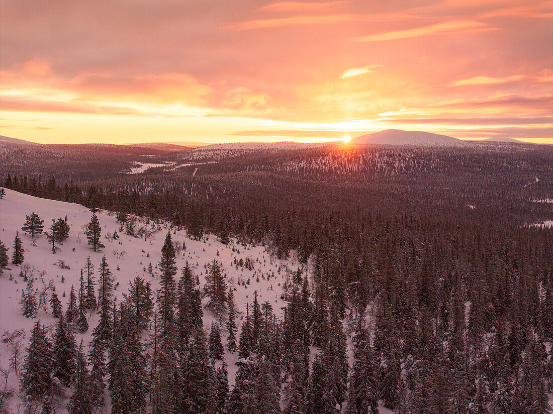 An amazing winter sunrise in Pallastunturi National Park shot by drone, Pallastunturi, Finland, Europe