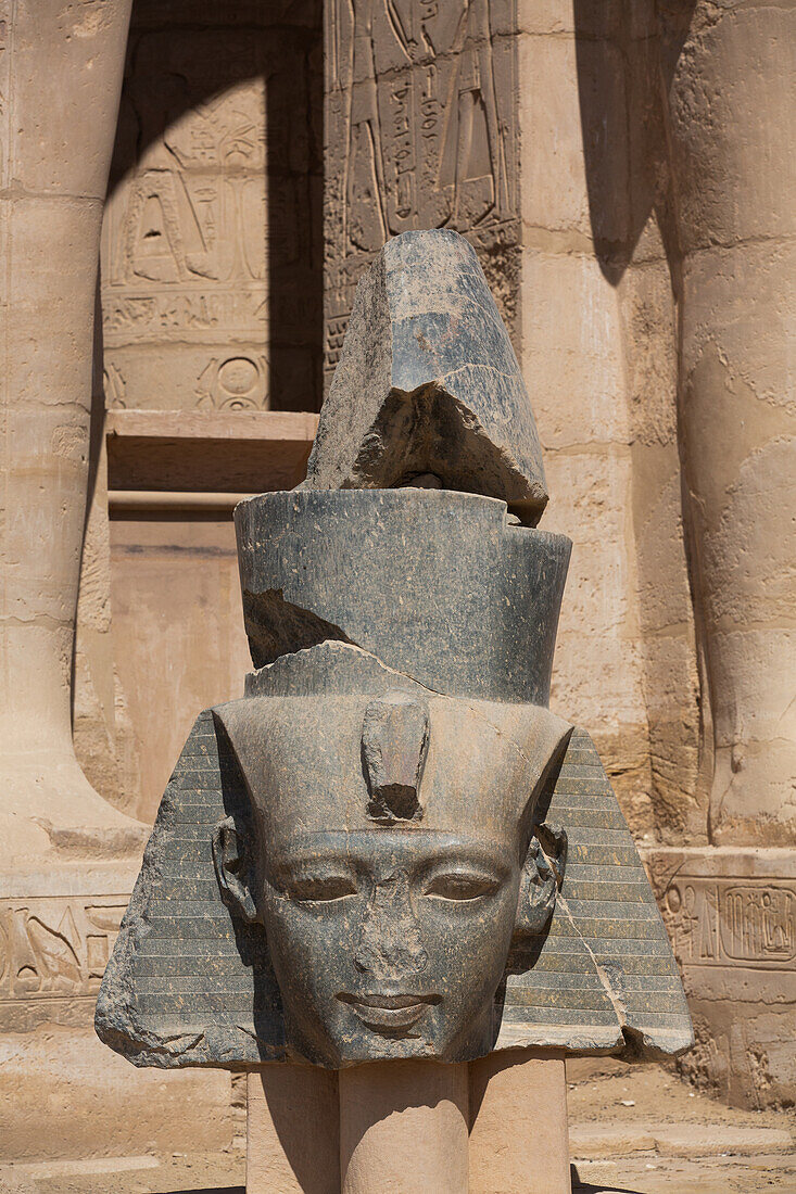 Granite Head of Ramesses II in front of Osiris Statues, Ramesseum, Memorial Temple of Pharaoh Ramesses II, 13th century BC, Ancient Thebes, UNESCO World Heritage Site, Luxor, Egypt, North Africa, Africa