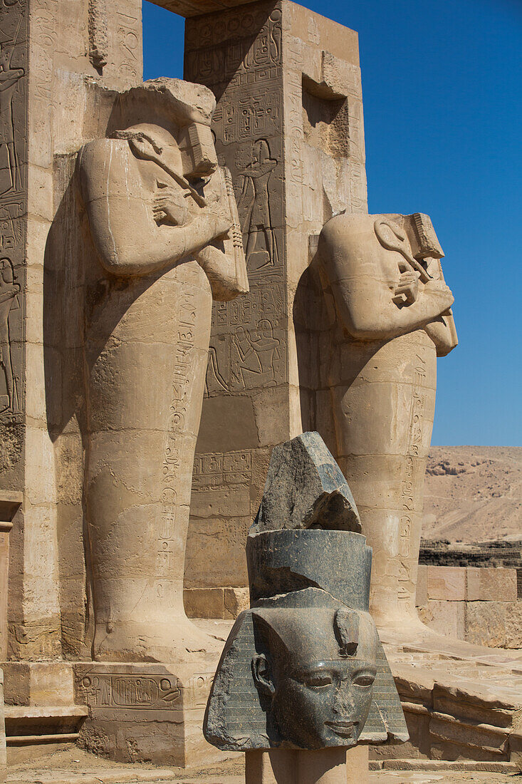 Granite Head of Ramesses II in front of Osiris Statues, Ramesseum, Memorial Temple of Pharaoh Ramesses II, 13th century BC, Ancient Thebes, UNESCO World Heritage Site, Luxor, Egypt, North Africa, Africa