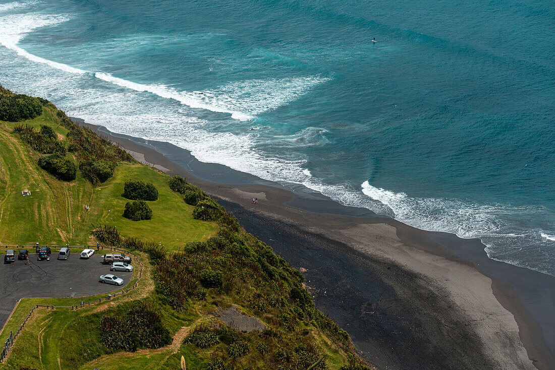 Aerial view along the blue coastline of the North Island with black sand beach and turquoise waters, close to New Plymouth, North Island, New Zealand, Pacific