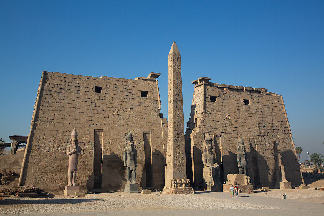 Statues of Rameses II with Obelisk, First Pylon of Rameses II, Luxor Temple, UNESCO World Heritage Site, Luxor, Egypt, North Africa, Africa