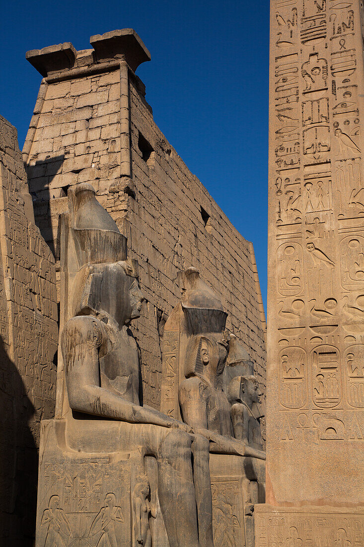 Statues of Rameses II with Obelisk, First Pylon of Rameses II, Luxor Temple, UNESCO World Heritage Site, Luxor, Egypt, North Africa, Africa