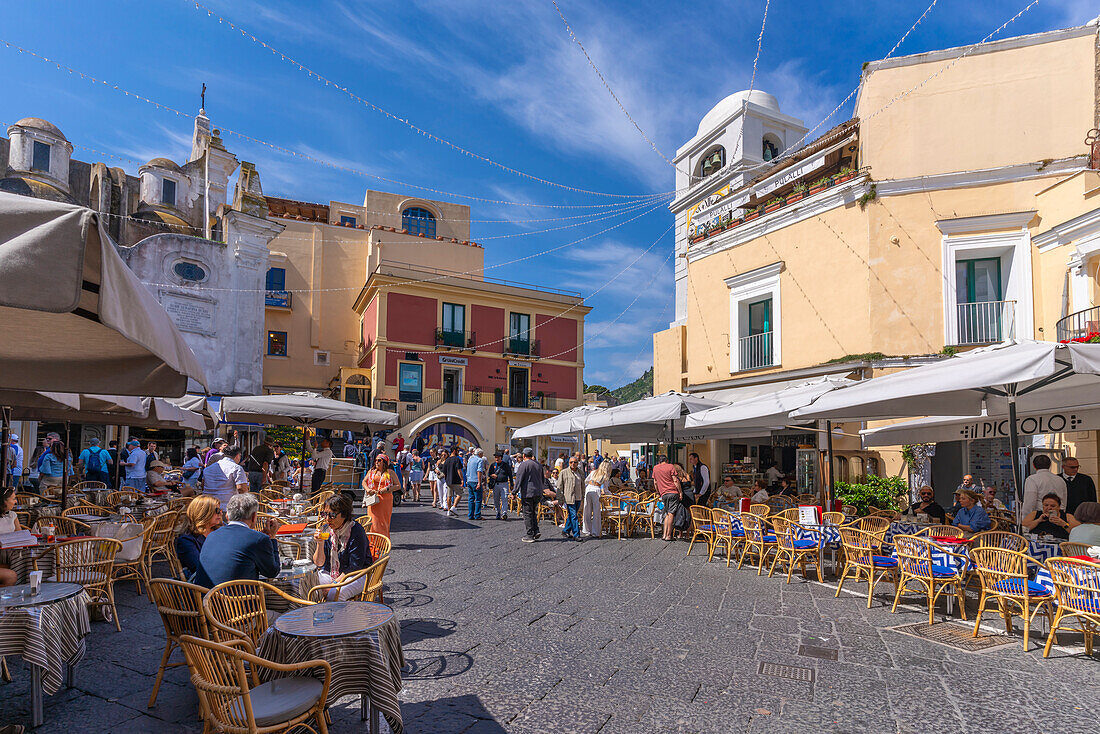 View of Clock Tower and cafes in Piazza Umberto I (La Piazzetta), Capri Town, Isle of Capri, Bay of Naples, Campania, Italy, Mediterranean, Europe