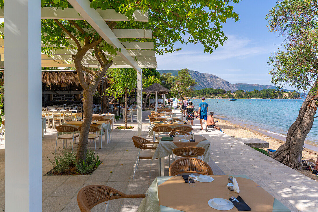 View of alfresco dining at Dassia Beach and Ionian Sea, Dassia, Corfu, Ionian Sea, Greek Islands, Greece, Europe