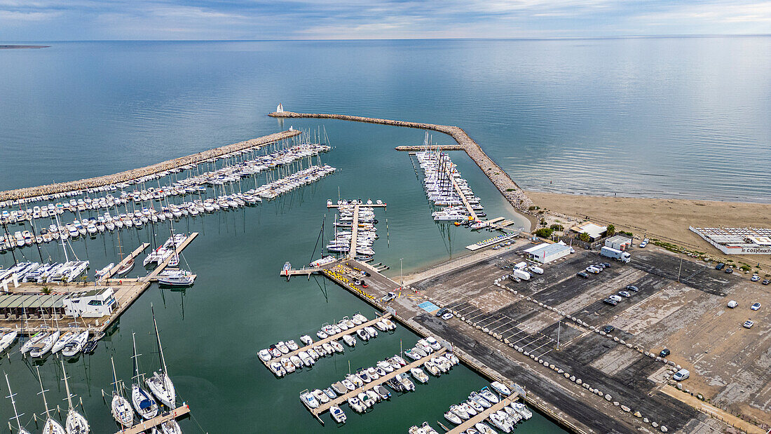 Aerial of the sport harbour, futuristic seaside town of La Grande Motte, Herault, Occitania, France, Europe