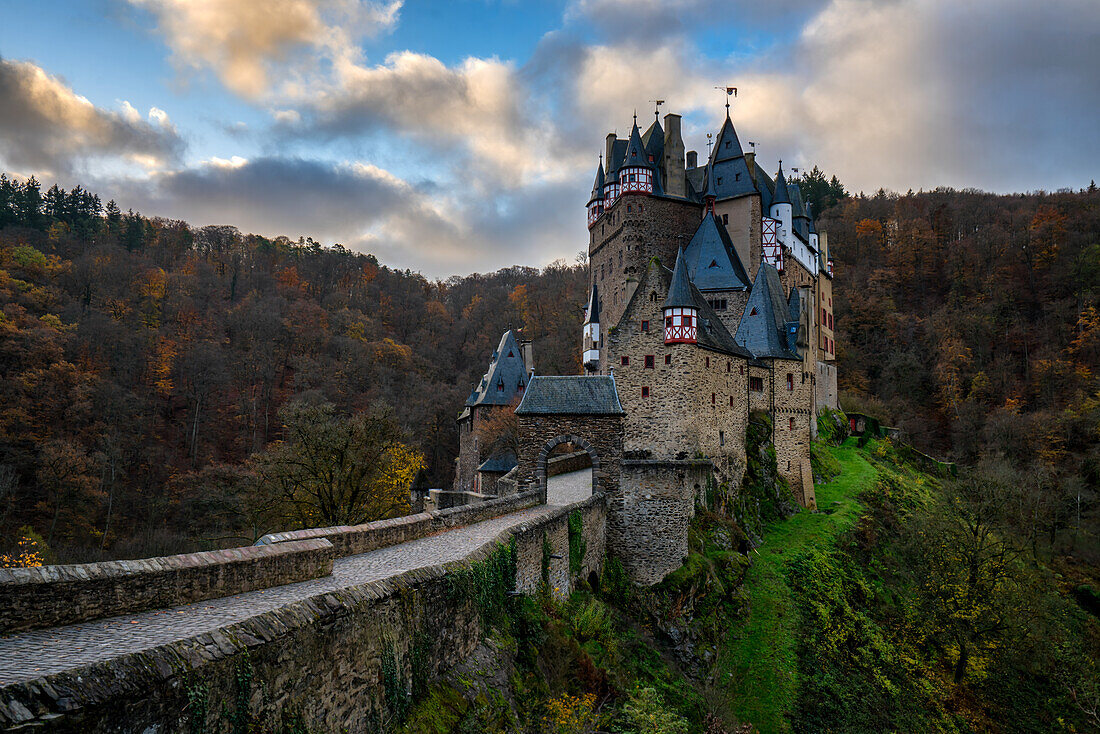 Eltz medieval historic castle in an autumn landscape with trees at sunrise, Wierschem, Rhineland-Palatinate, Germany, Europe