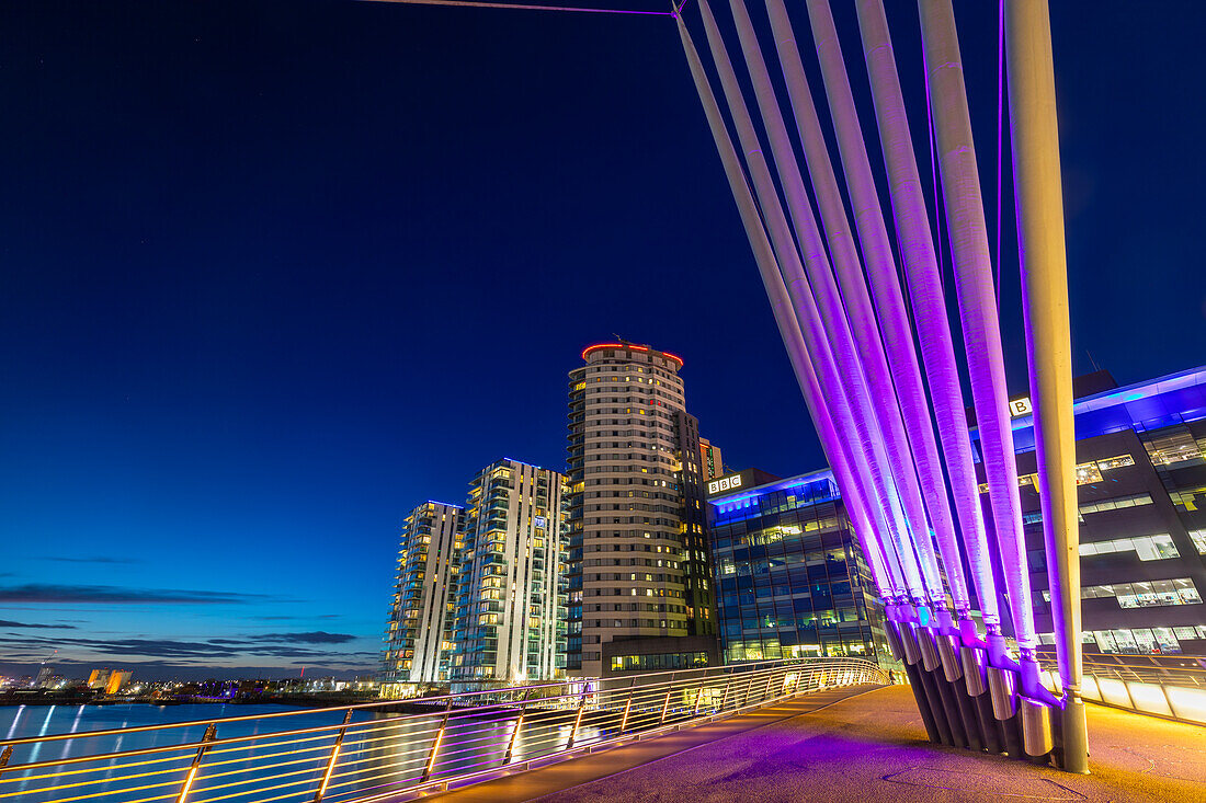 Media City footbridge at dusk, Media City UK, Salford Quays, Greater Manchester, England, United Kingdom, Europe