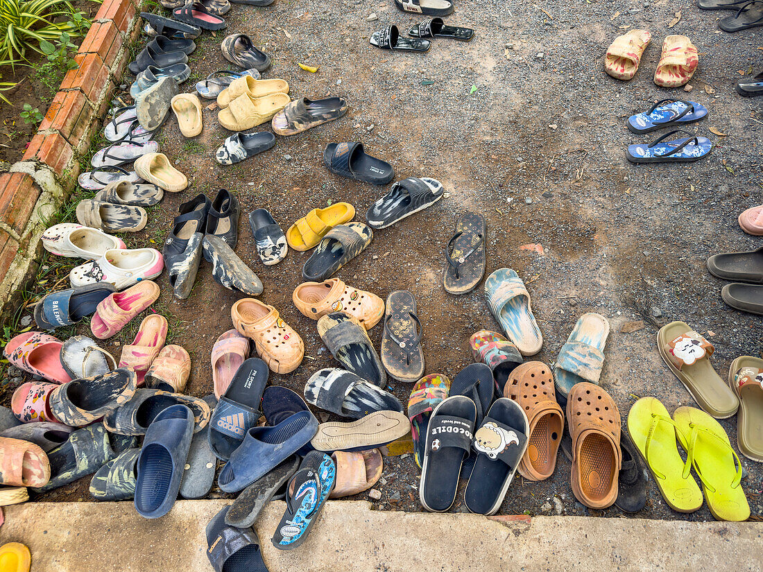 Shoes belonging to school children at the Green School in Kampong Tralach, Cambodia, Indochina, Southeast Asia, Asia