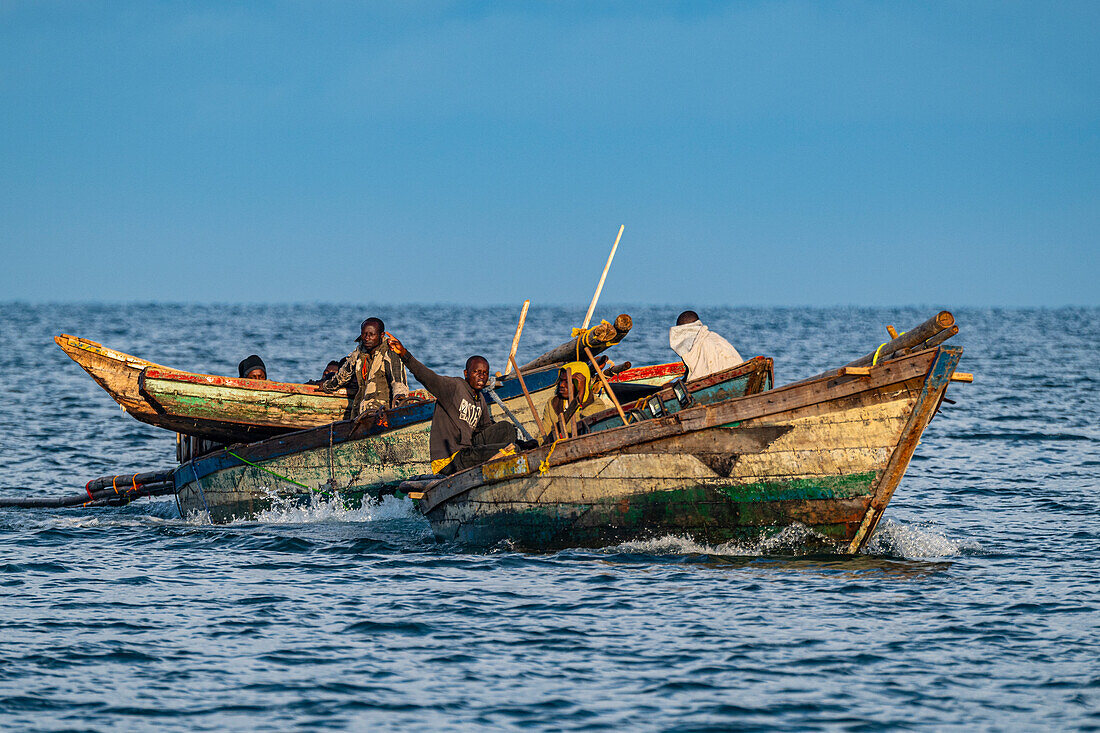 Wooden fishing boats and fishermen, Kigoma, Lake Tanganyika, Tanzania, East Africa, Africa