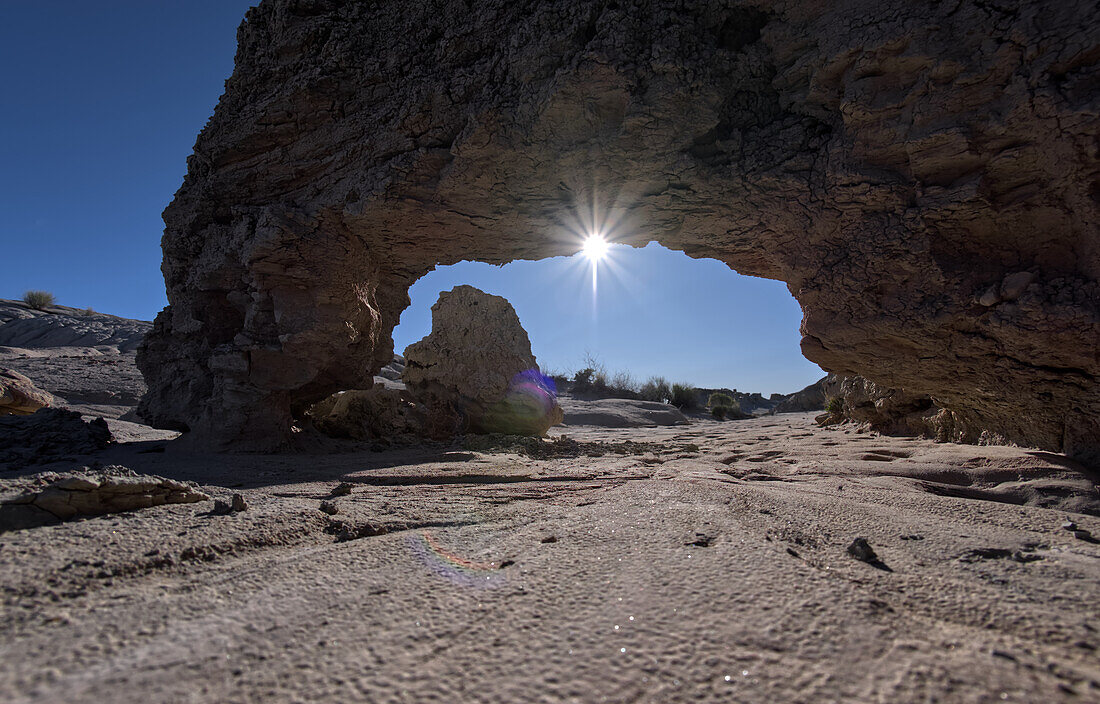 A small bentonite arch in Goblin Garden west of Hamilili Point in Petrified Forest National Park, Arizona, United States of America, North America