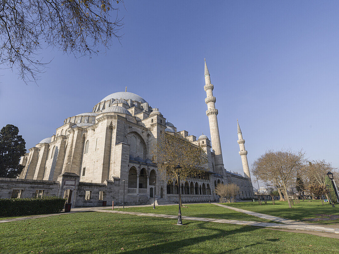 The park of Suleymaniye Mosque, UNESCO World Heritage Site, on a sunny day with a clear blue sky, Istanbul, Turkey, Europe