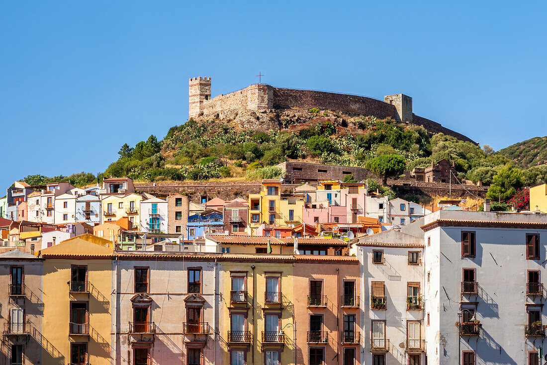 Bosa city colorful buildings with castle on top of the hill and Vecchio bridge crossing Temo river, Bosa, Sardinia, Italy, Mediterranean, Europe