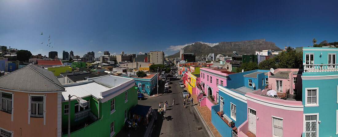 Aerial drone panoramic view of Bo-Kaap, formerly known as the Malay Quarter, formerly a racially segregated area, on the slopes of Signal Hill above the city centre, Cape Town, Western Cape, South Africa, Africa