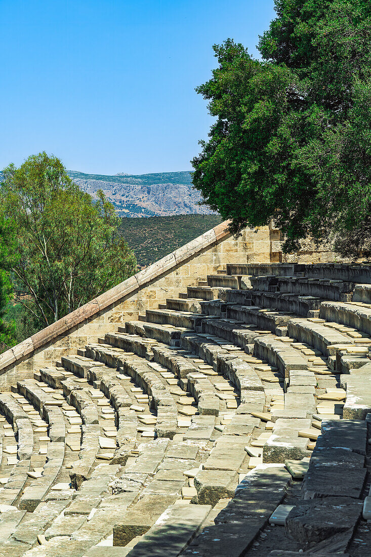 Ancient Greek Theater, empty marble seats detail against blue sky, the Asclepieion of Epidavros (Epidauros), UNESCO World Heritage Site, Greece, Europe