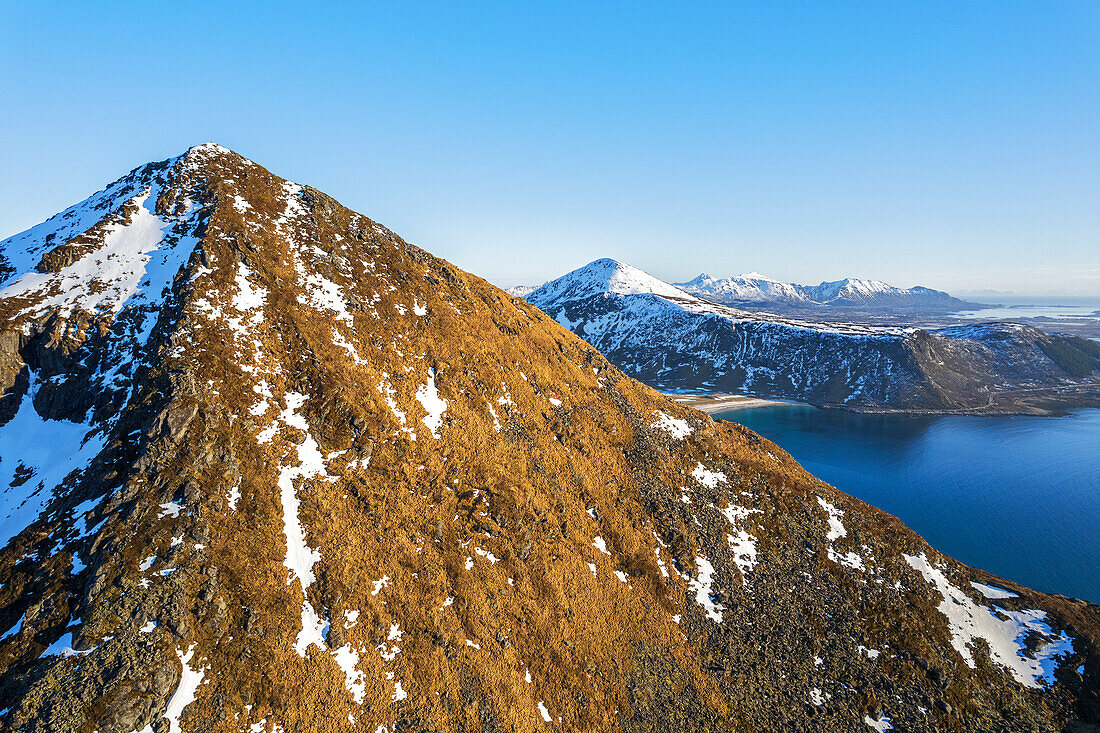 Aerial view of the Arctic landscape at thaw with the beach of Vik in the background, spring time, Vestvagoy, Lofoten Islands, Norway, Scandinavia, Europe