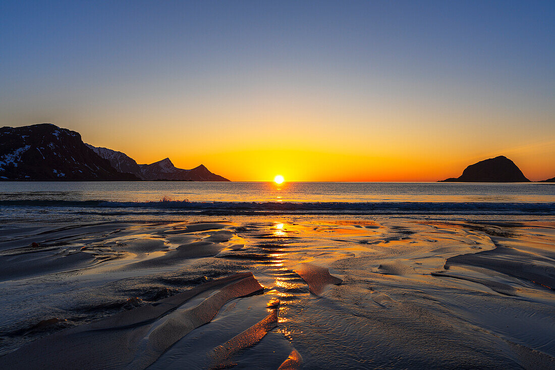 Patterns created by the small river on a sandy beach at sunset, Vik beach, Vestvagoy, Lofoten Islands, Norway, Scandinavia, Europe