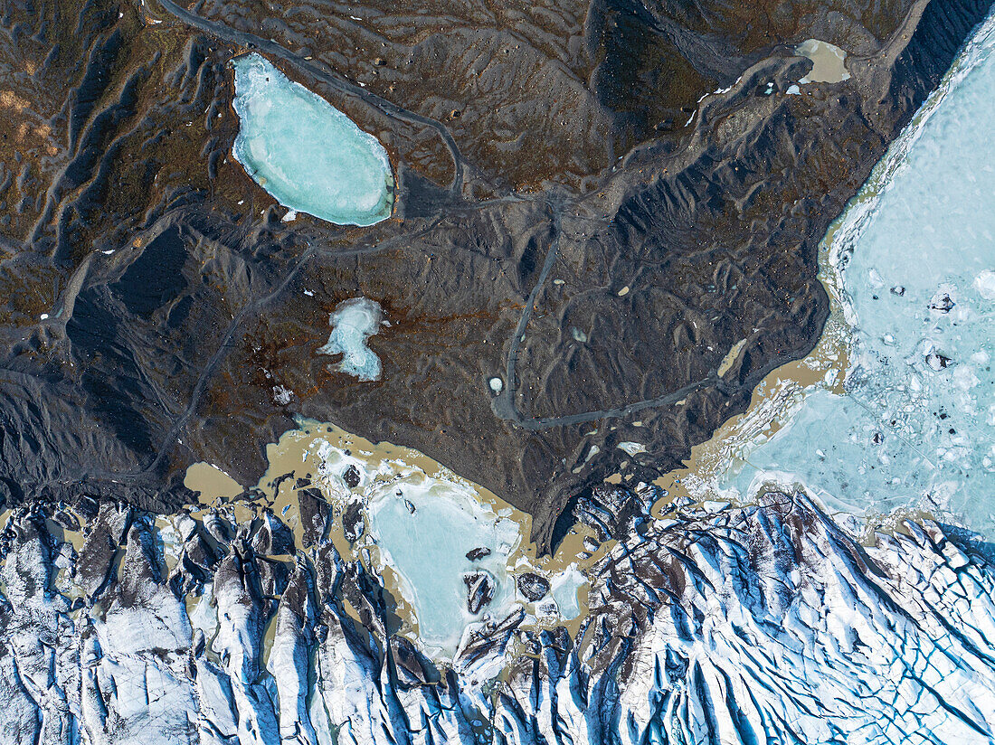 Aerial drone view of particular ice textures formed in the Svinafellsjokull glacier following global warming, Iceland, Polar Regions