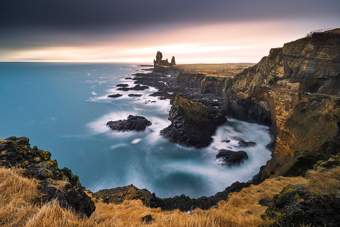 The splendid basalt rock cliff of Londrangar, taken with a long exposure on a cold winter day, Iceland, Polar Regions