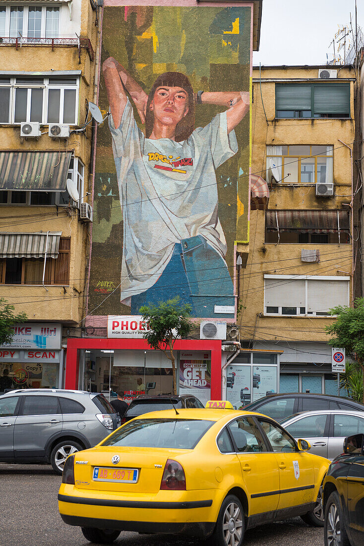 Yellow cab and mural painting, Tirana, Albania, Europe