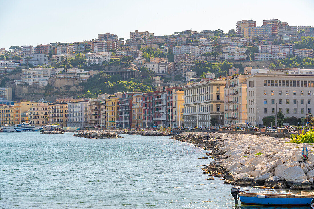 View of pastel coloured architecture on waterfront of Via Francesco Caracciolo, Naples, Campania, Italy, Europe