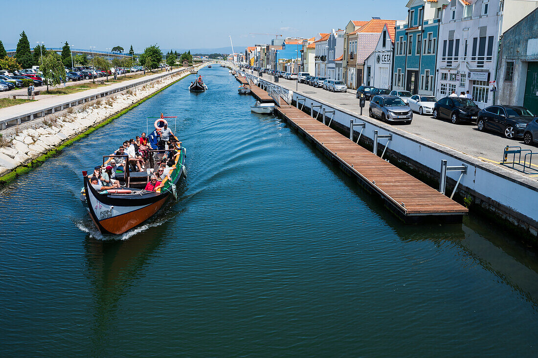 Boat ride through canals in a colorful and traditional Moliceiro boat, Aveiro, Portugal