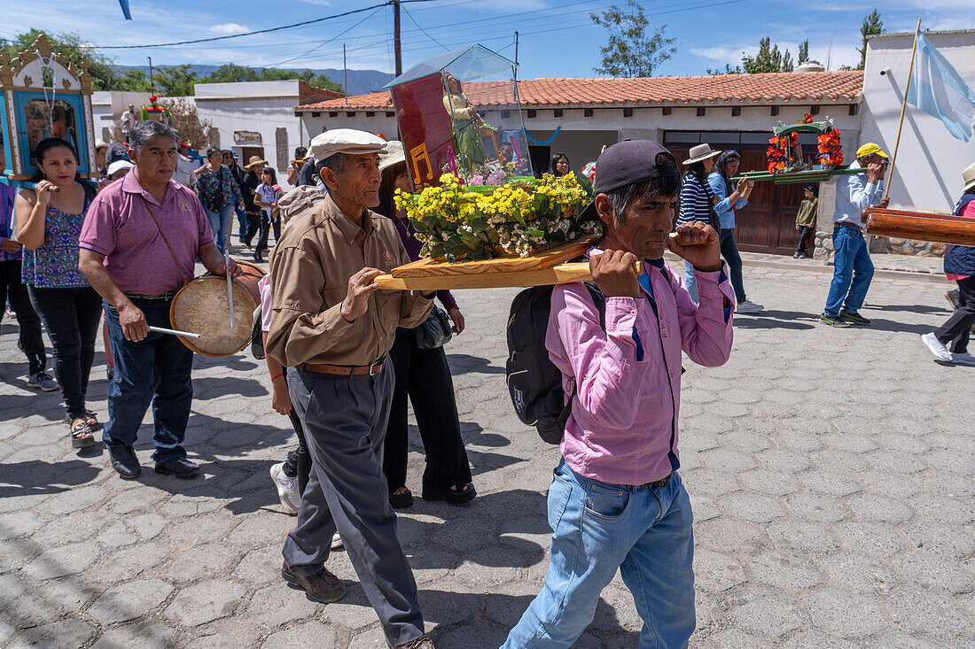 Parishioners carry religious statues and icons in the procession on Saint Joseph's Day in Cachi, Argentina.