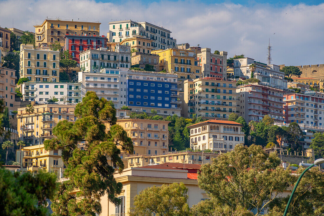 View of pastel coloured villas near Sant'Elmo Castle from Rotonda Diaz, Naples, Campania, Italy, Europe