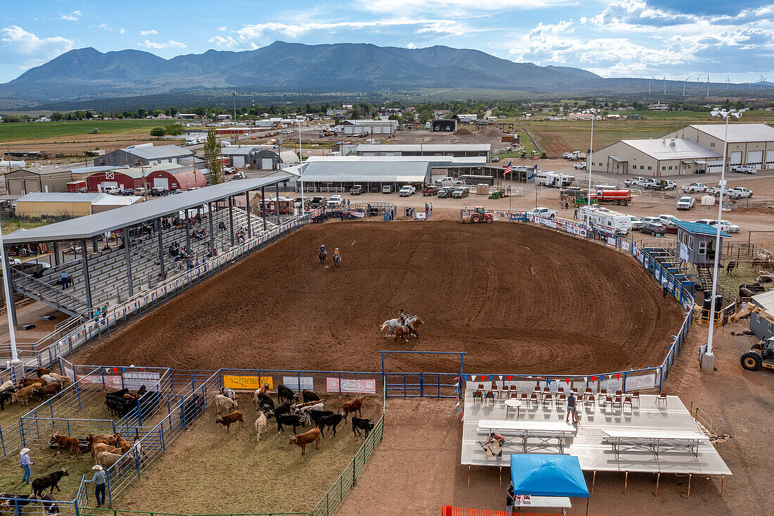 Aerial view of the San Juan County Rodeo Arena in Monticello, Utah. Workers are preparing the arena for the rodeo.