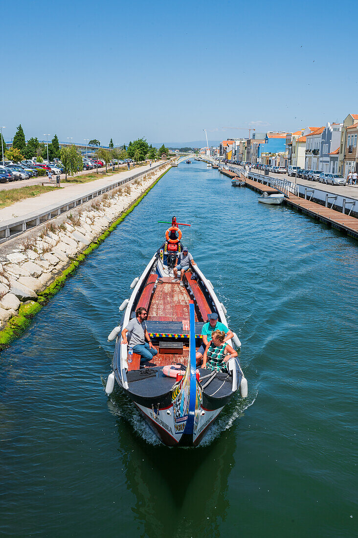 Boat ride through canals in a colorful and traditional Moliceiro boat, Aveiro, Portugal