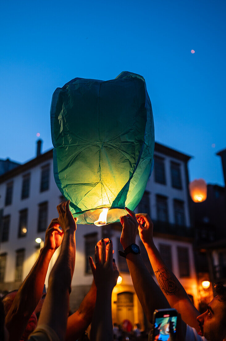 Hot air balloons launching during Festival of St John of Porto (Festa de São João do Porto ) during Midsummer, on the night of 23 June (Saint John's Eve), in the city of Porto, Portugal