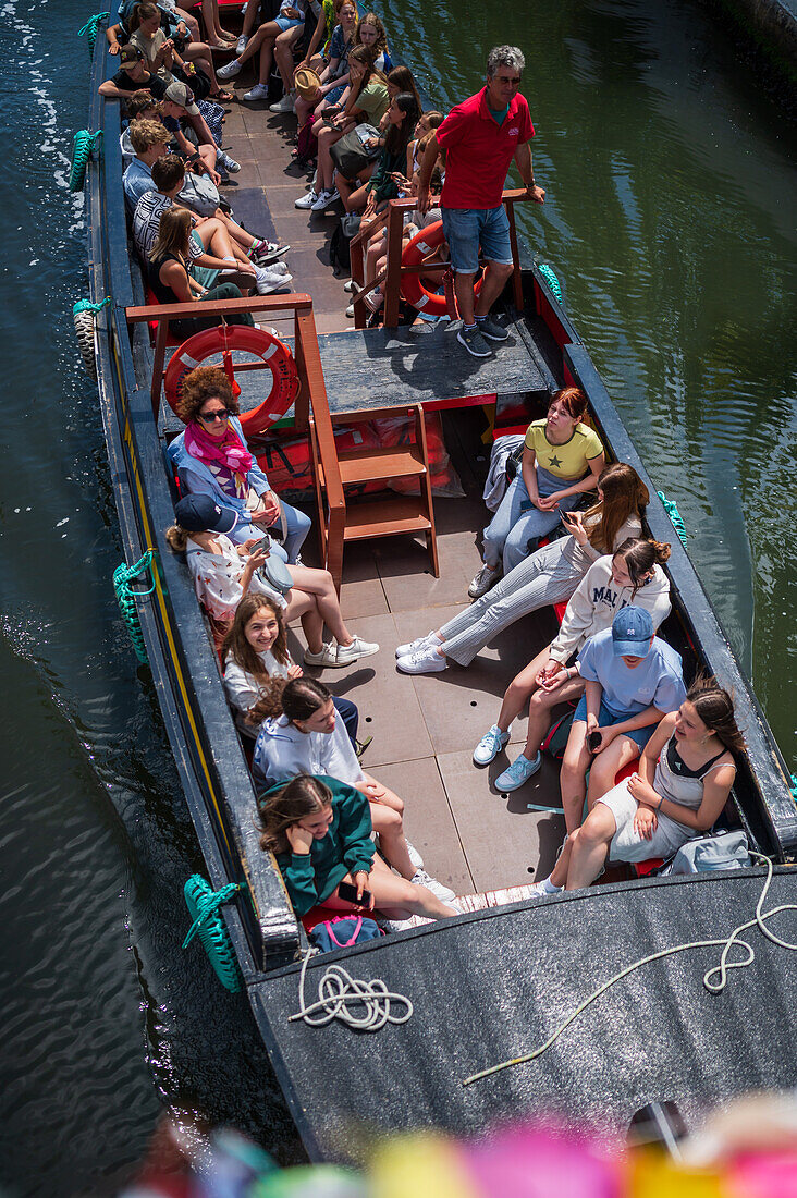 Boat ride through canals in a colorful and traditional Moliceiro boat, Aveiro, Portugal