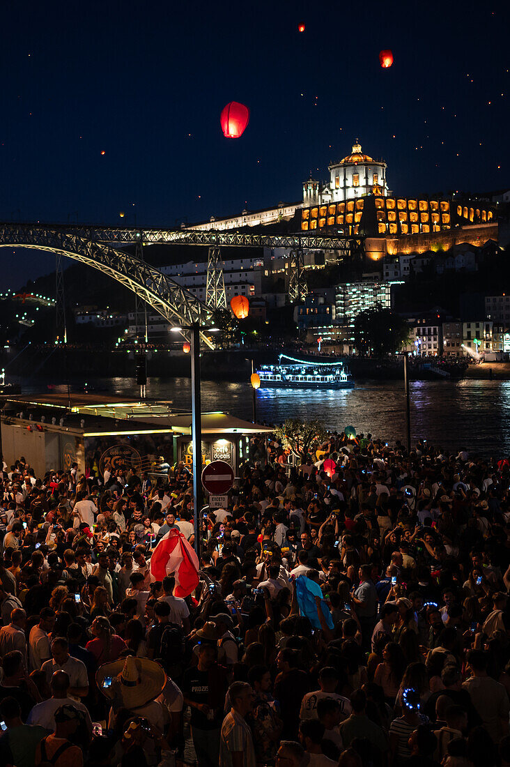 Hot air balloons launching over Luis I bridge and Douro River during Festival of St John of Porto (Festa de São João do Porto ) during Midsummer, on the night of 23 June (Saint John's Eve), in the city of Porto, Portugal