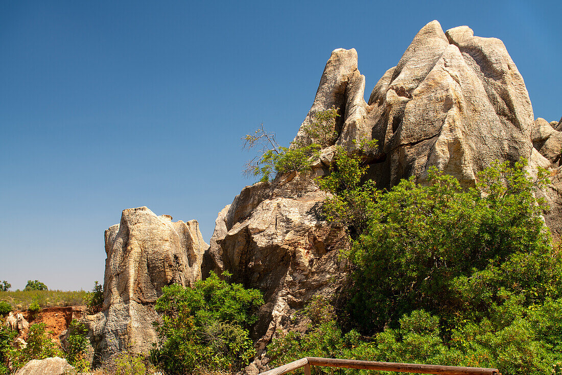 Beautiful landscape of the karstic formations at Monumento Natural Cerro del Hierro in Sierra Norte de Sevilla, Spain, showcasing unique geology and lush vegetation.