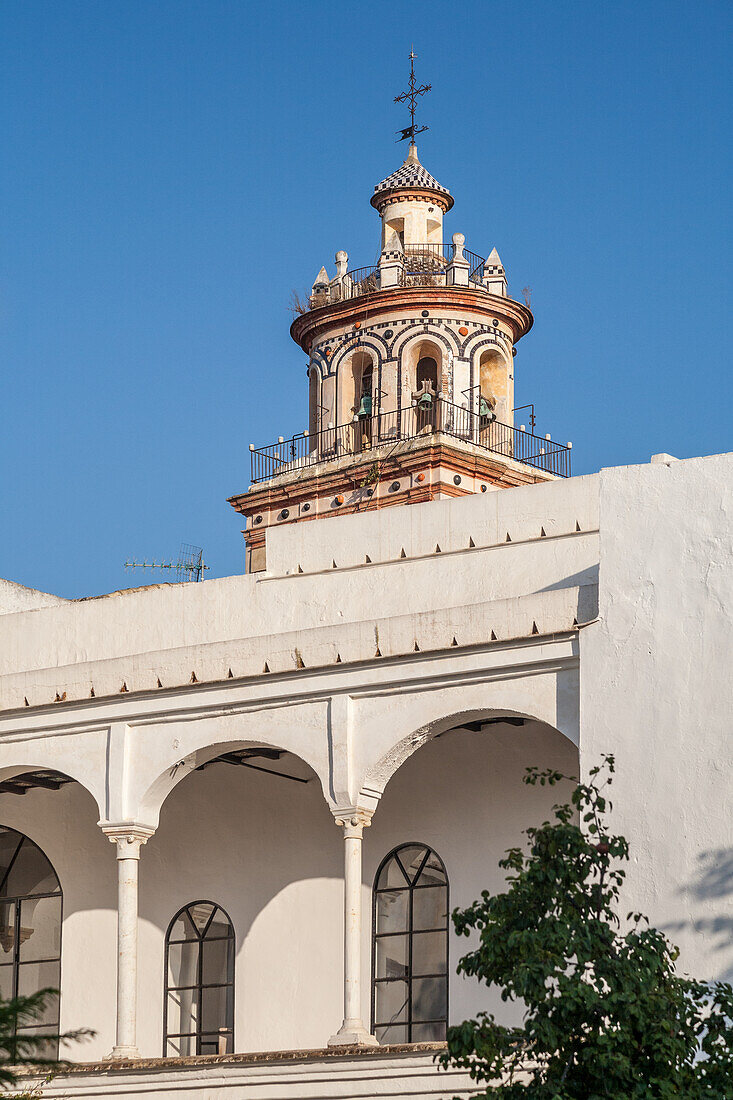 View of the Palacio Ducal de Medina Sidonia and the tower of the La O Church in Sanlucar de Barrameda, Cadiz, Spain.