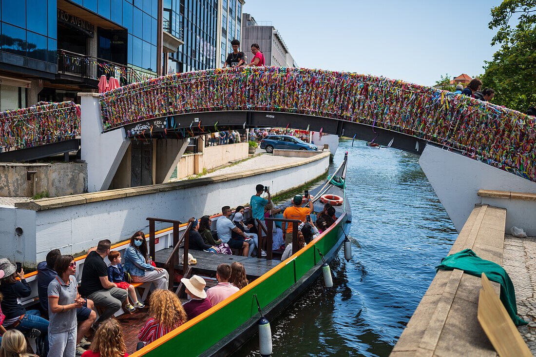 Boat ride through canals in a colorful and traditional Moliceiro boat, Aveiro, Portugal