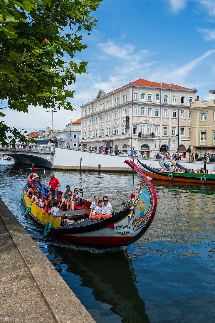 Boat ride through canals in a colorful and traditional Moliceiro boat, Aveiro, Portugal