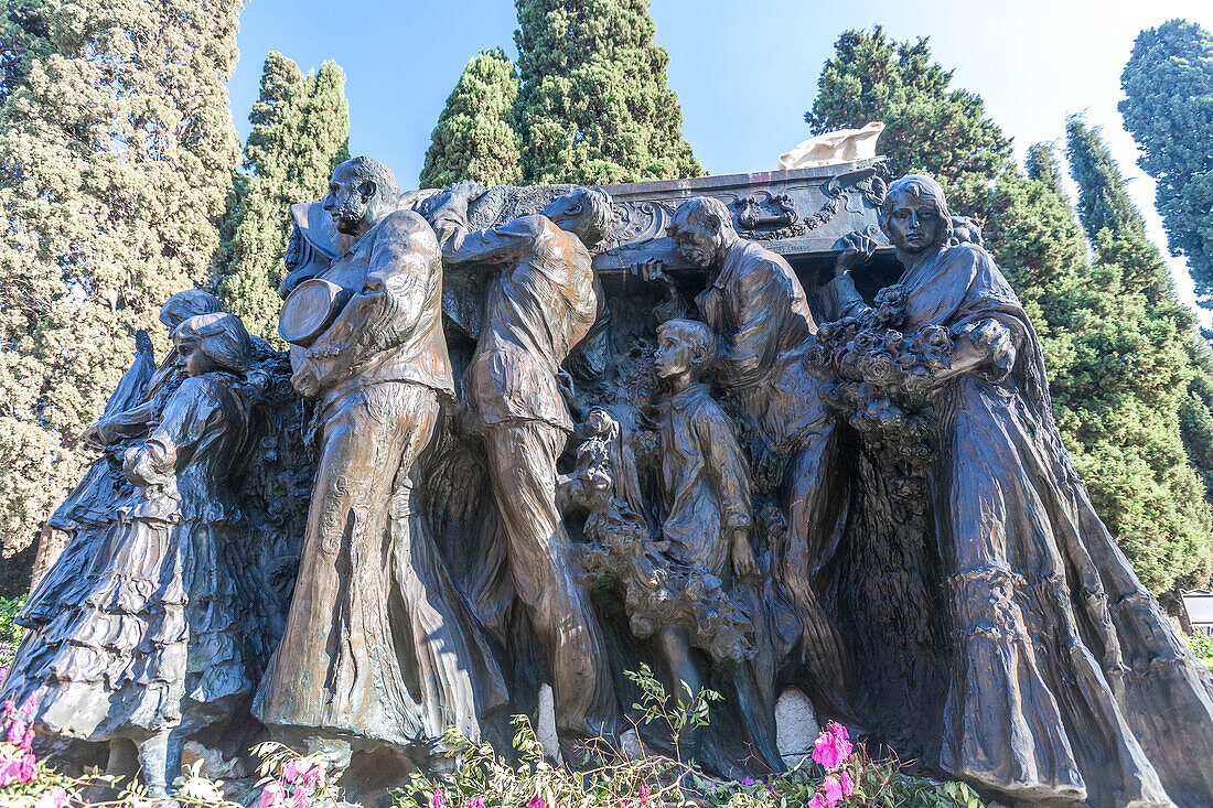 Bronze sculpture group by Mariano Benlliure at the tomb of bullfighter Joselito in Cementerio de San Fernando, Sevilla, Spain. Monumental artwork representing sorrow and homage.