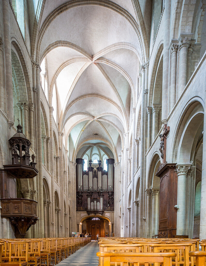 Elegant interior of Men's Abbey Church of Saint Etienne in Caen, Normandy, France showcasing exquisite architecture and historic atmosphere.