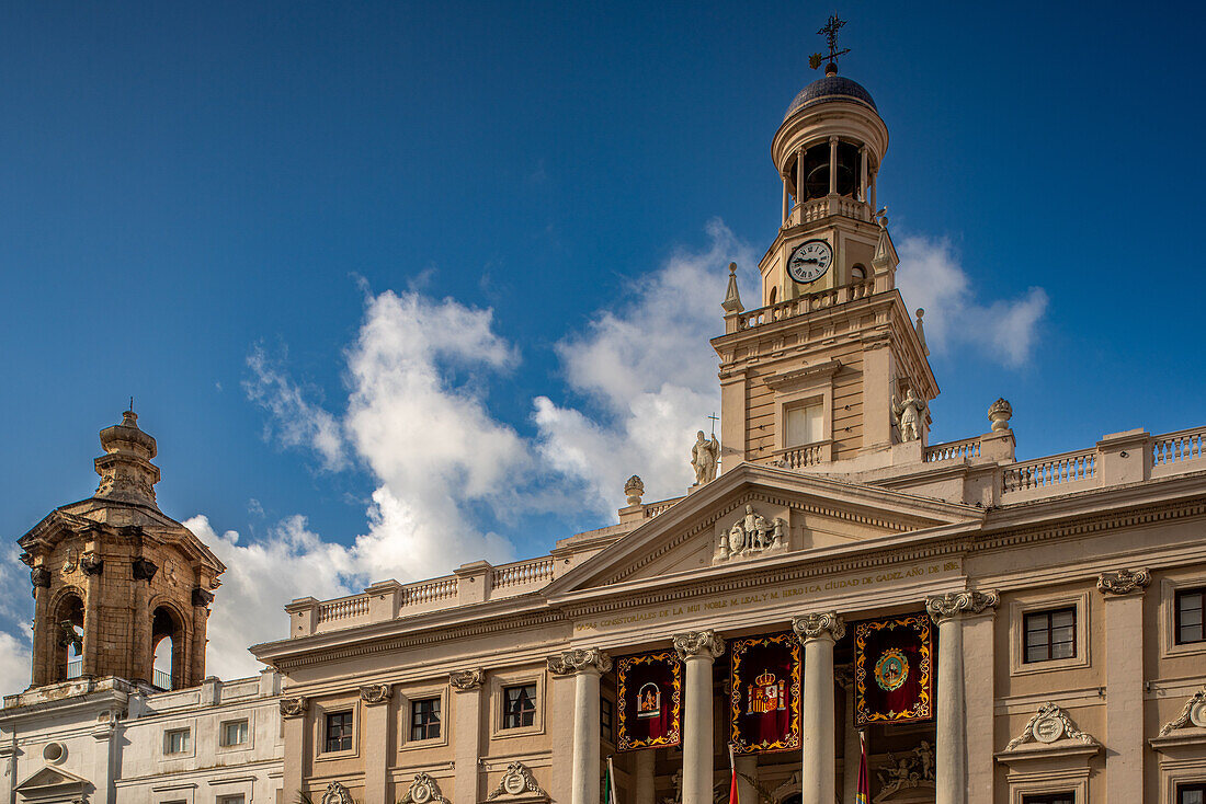 A beautiful view of the Ayuntamiento de Cadiz in Andalusia, Spain with its stunning architecture and clear blue sky.