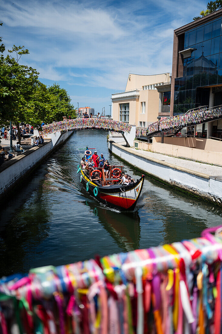 Boat ride through canals in a colorful and traditional Moliceiro boat, Aveiro, Portugal