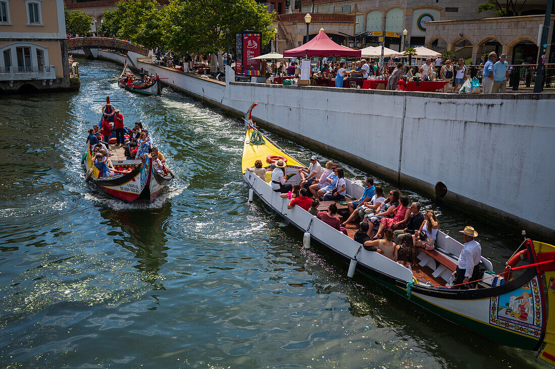 Boat ride through canals in a colorful and traditional Moliceiro boat, Aveiro, Portugal