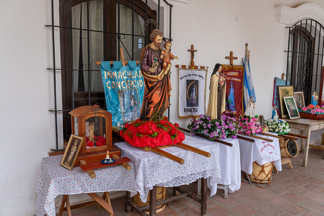 Religious statues and icons on display before the procession on Saint Joseph's Day in Cachi, Argentina.