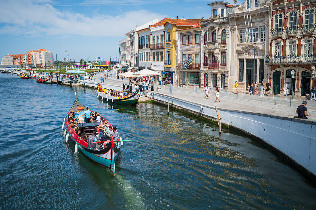 Boat ride through canals in a colorful and traditional Moliceiro boat, Aveiro, Portugal