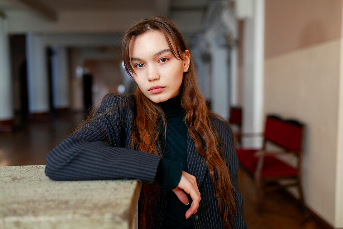 Portrait of woman standing in hallway