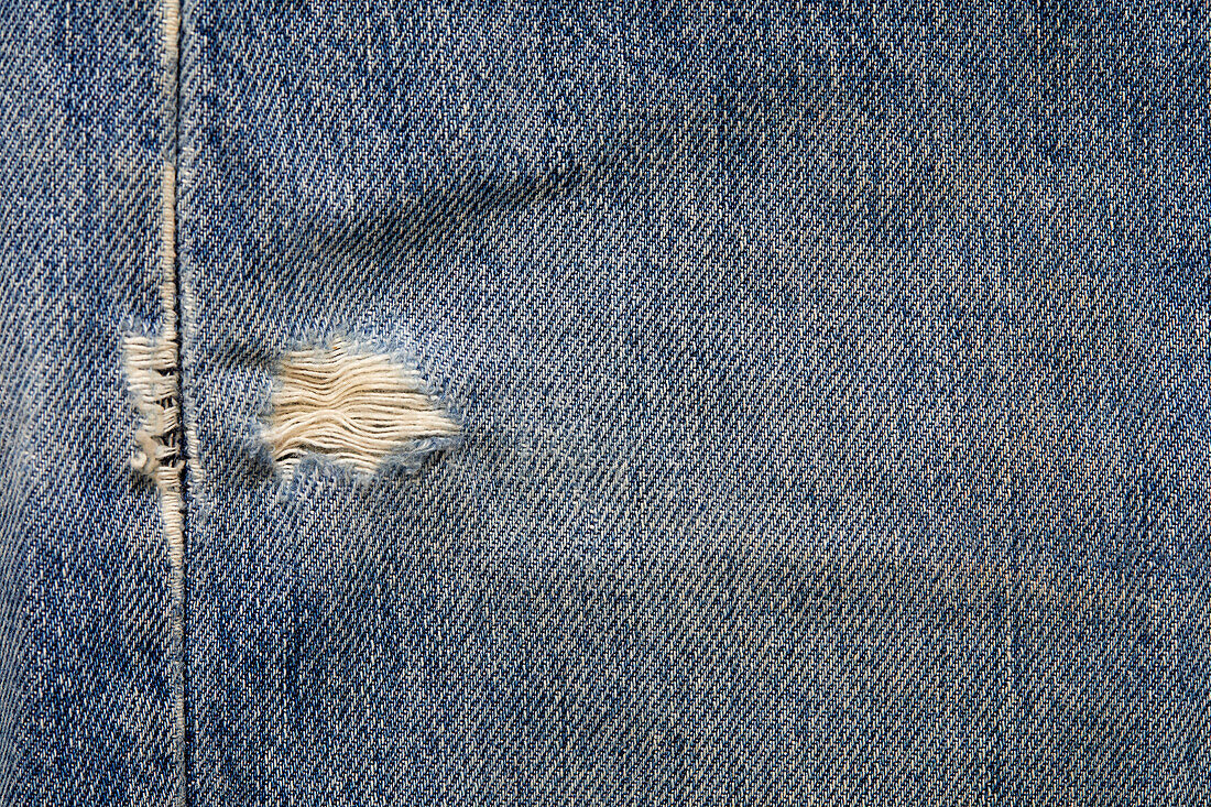 Close-up of worn jeans