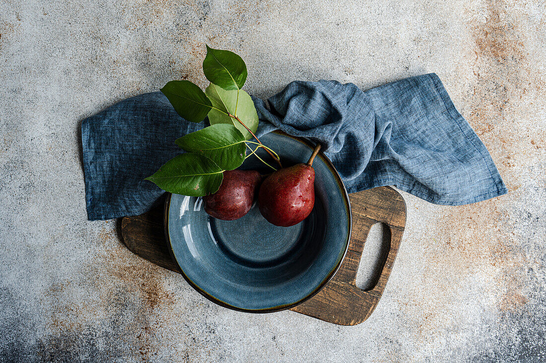 Red Batler pears on a ceramic plate